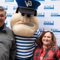 Alumni couple poses with Louie the Laker